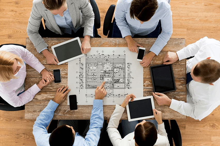 A web design team reviewing a storyboard together